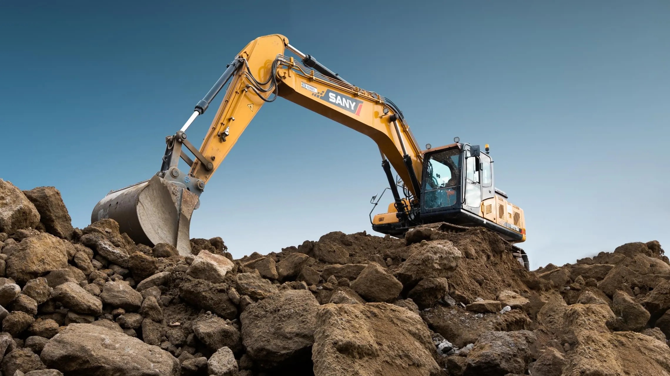 Excavator working on a rock site